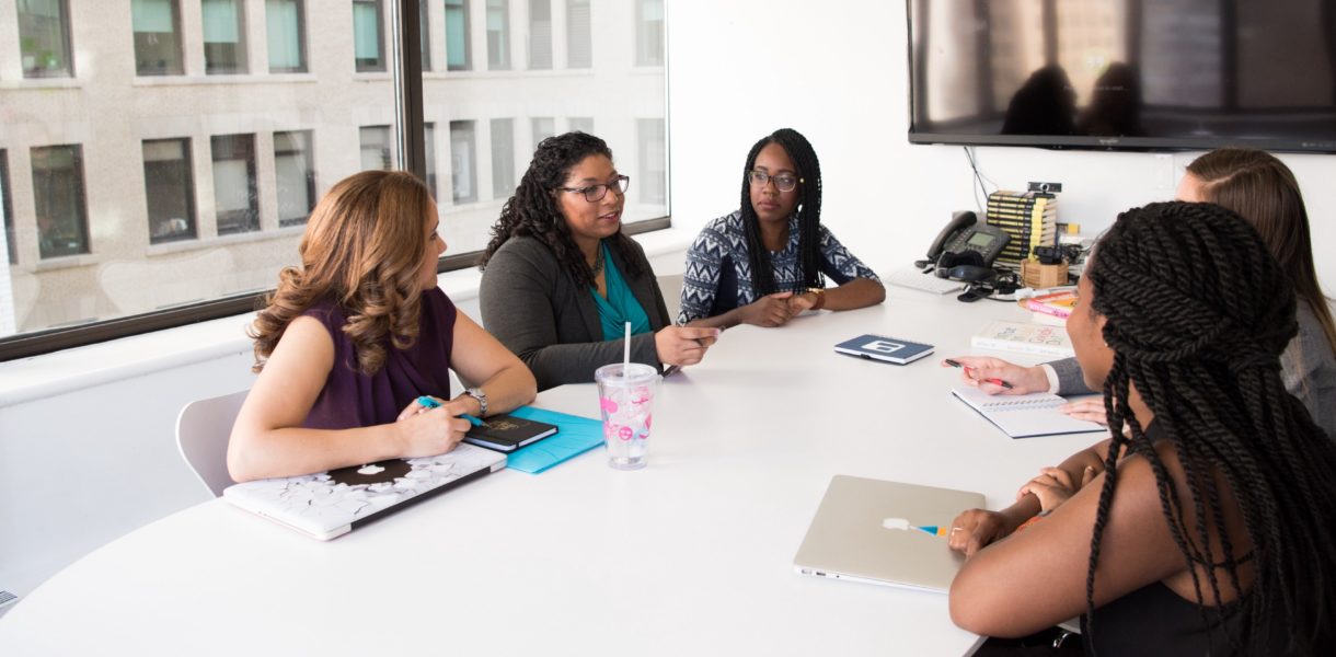 group of women sitting in office