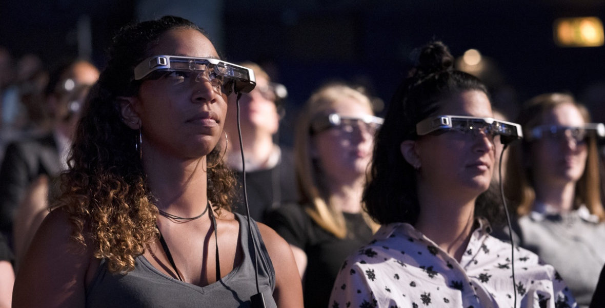 people using smart glasses for the launch of an automated captioning service aimed at the millions of people suffering from hearing loss.