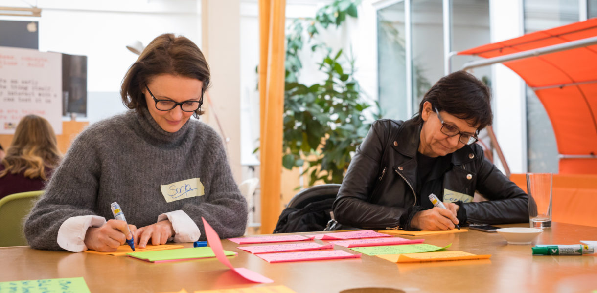 Two service designers working on a new digital service