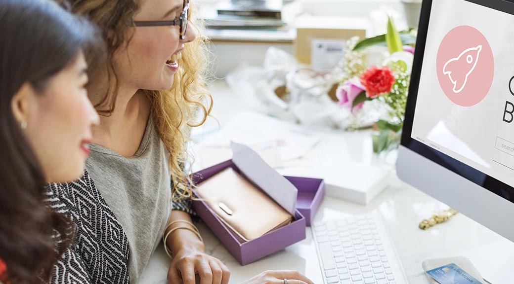 two women working on computer