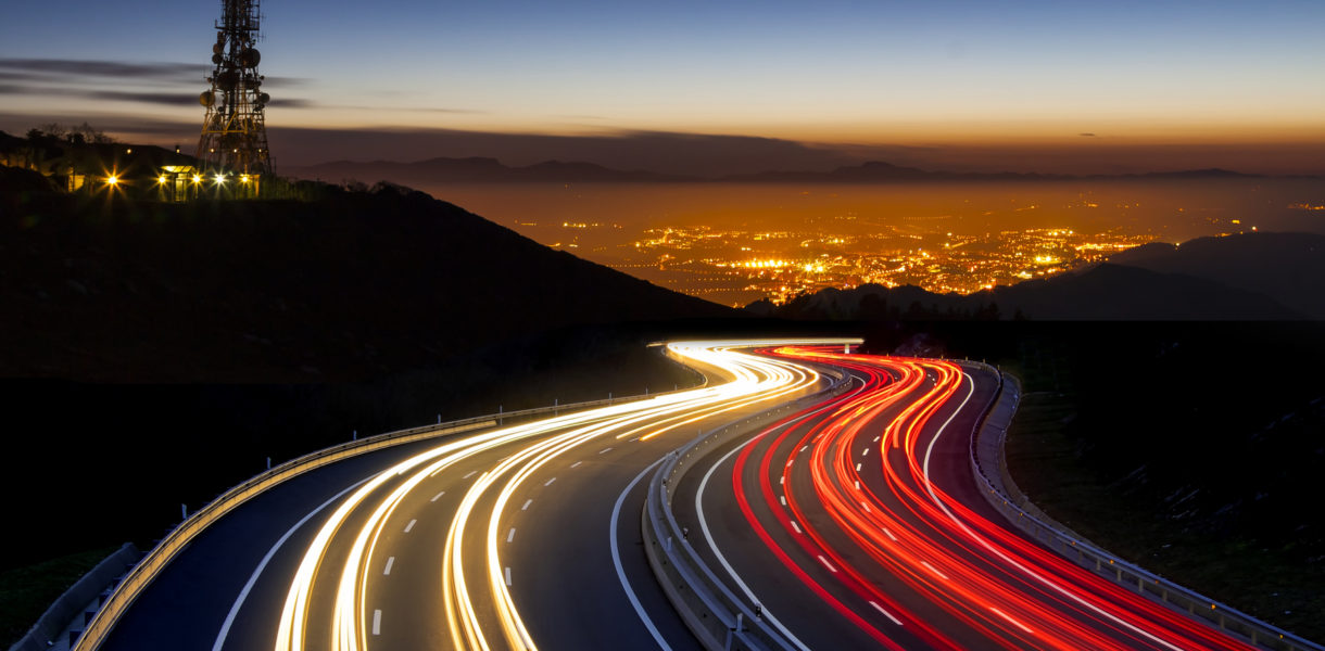 view over highway and city in fast-paced speed