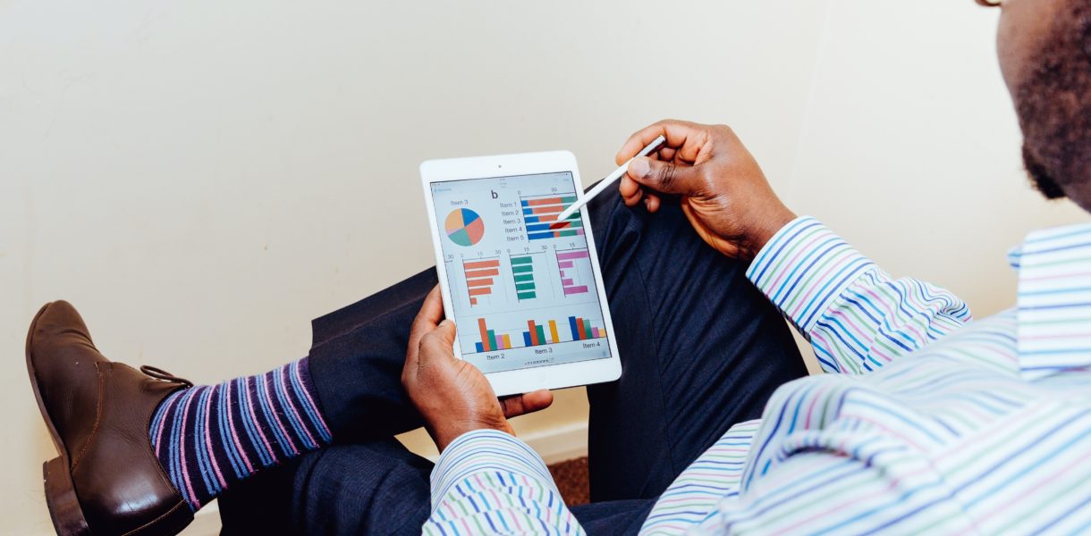 Man using data on an ipad