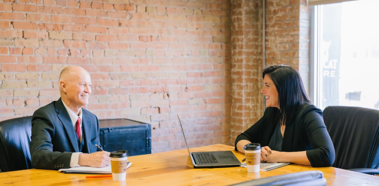 man and woman having a meeting