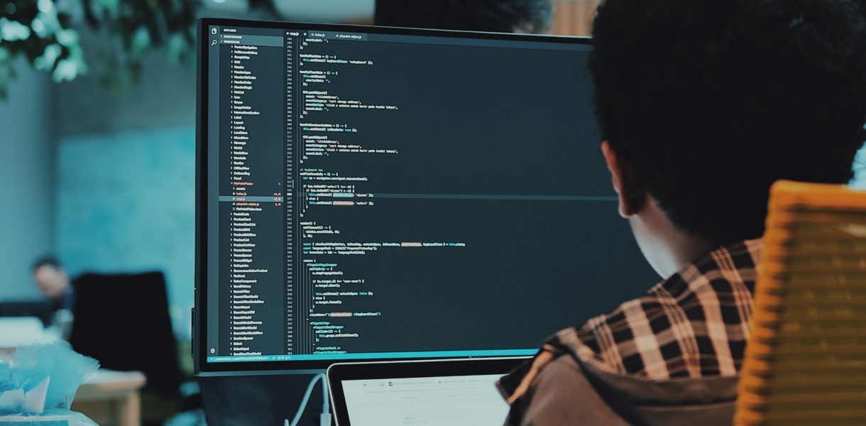 Someone using a computer to edit computer code