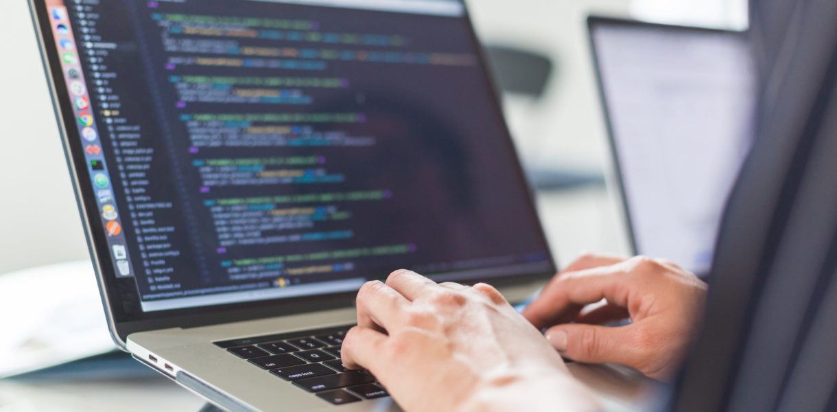 Someone on a laptop using low code