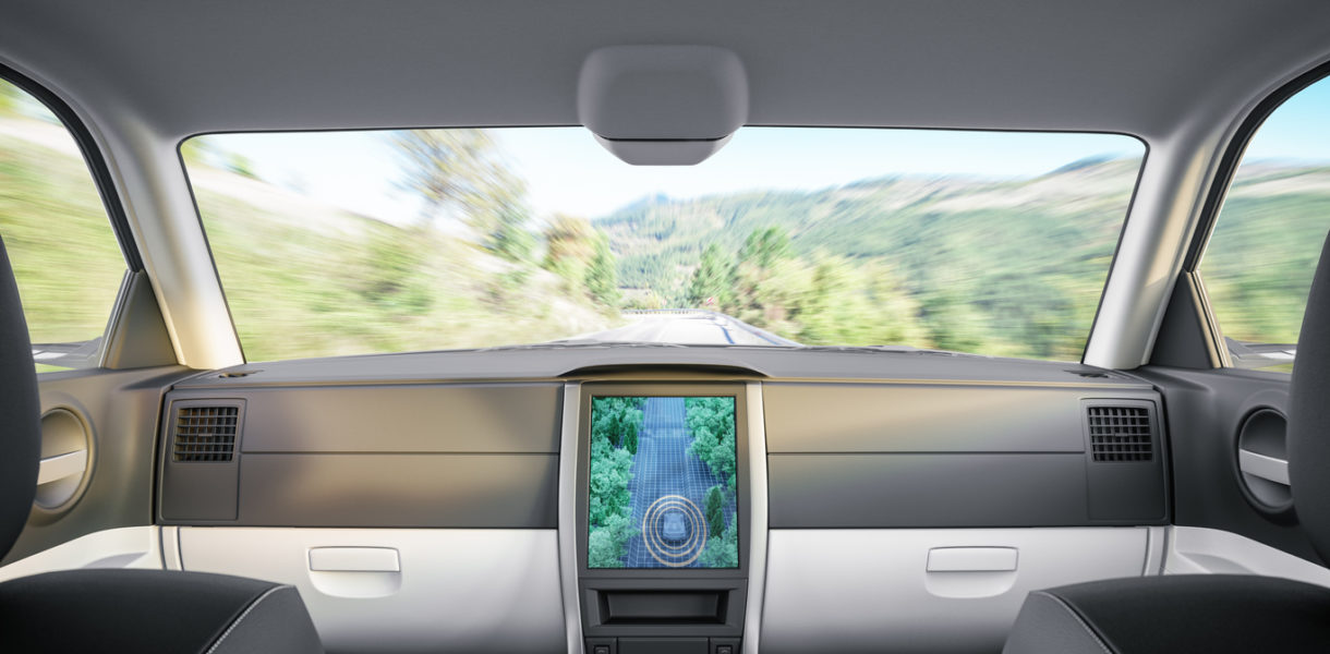 Interior of an autonomous self-driving car on the road.
