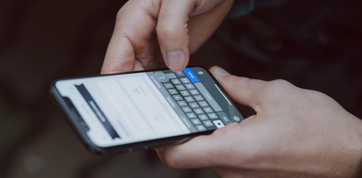 man holding smart phone
