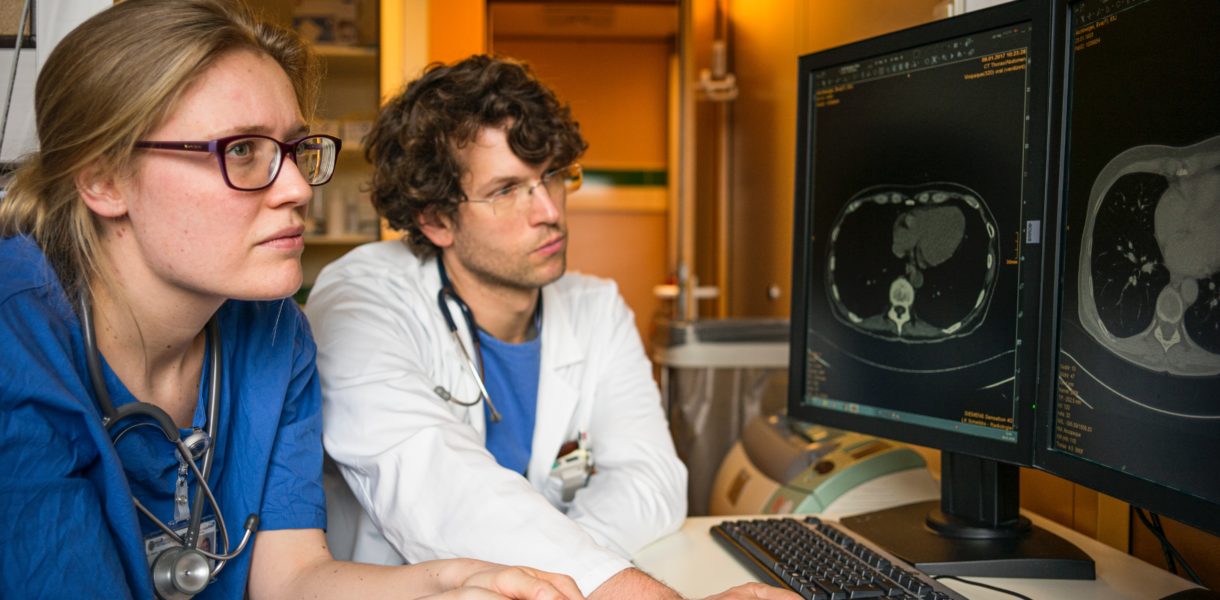 nurse and doctor using computer