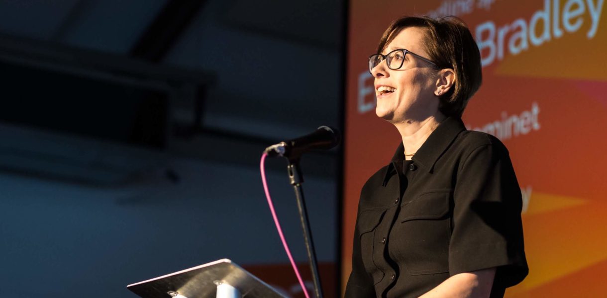Eleanor Bradley speaking at stage
