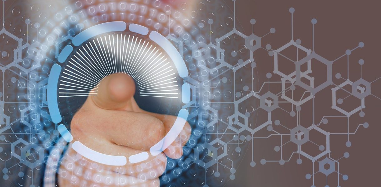 Man pointing on to a data screen