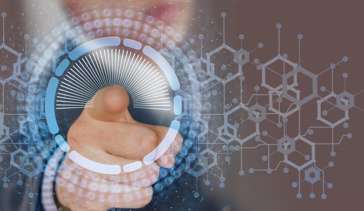 Man pointing on to a data screen