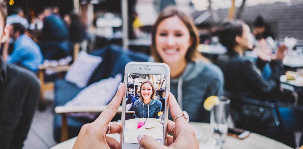 Girl taking a photo for Snapchat