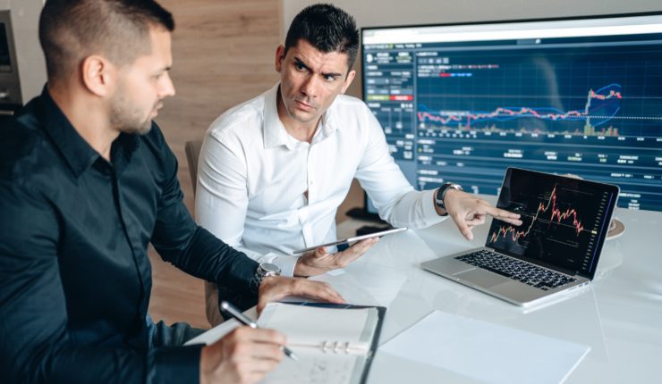 2 men looking at data
