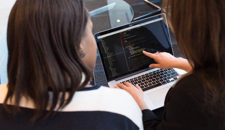 2 Women using a laptop