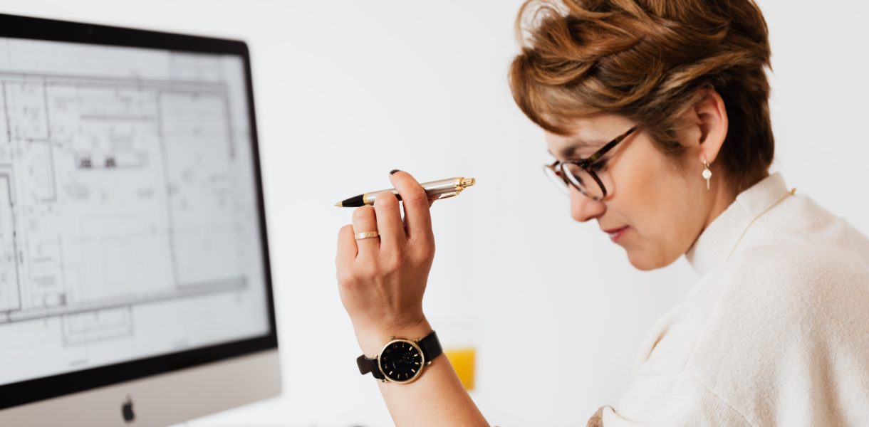 woman holding pencil