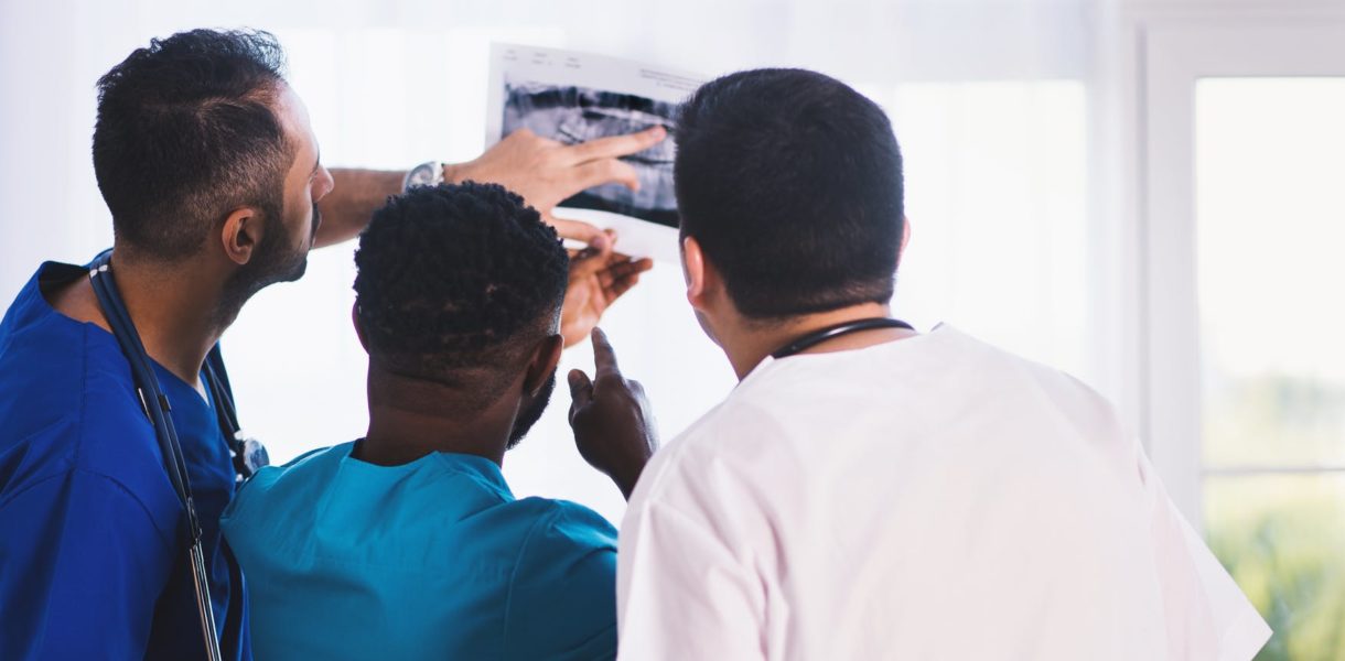 doctors and nurses looking at Xray