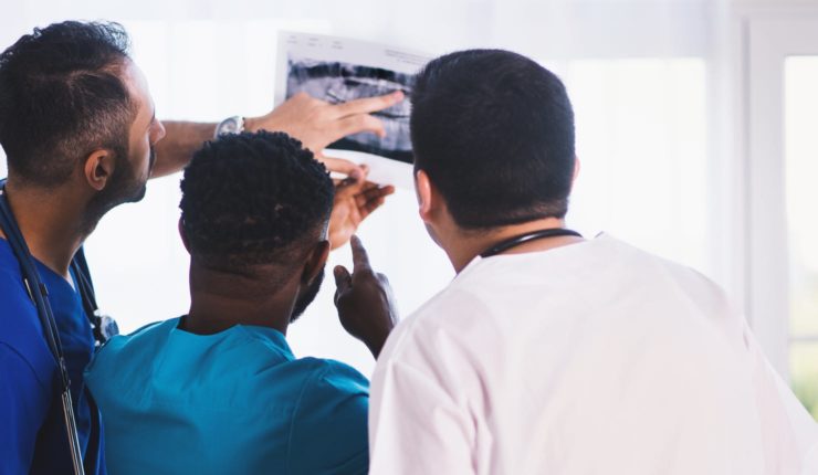 doctors and nurses looking at Xray