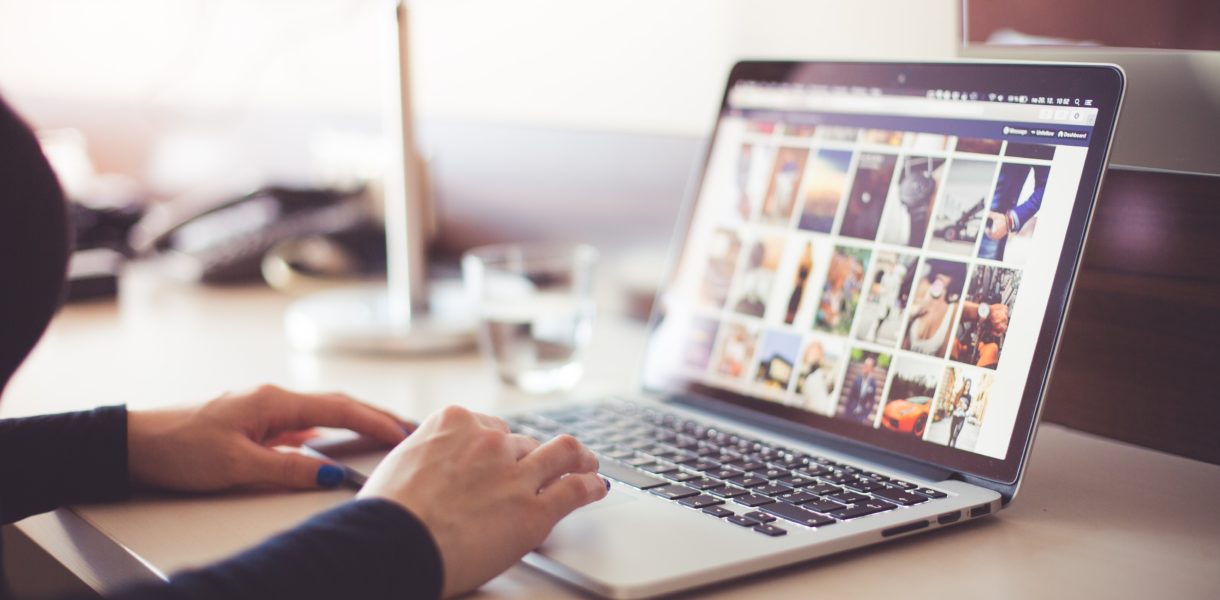 person using social media on a laptop