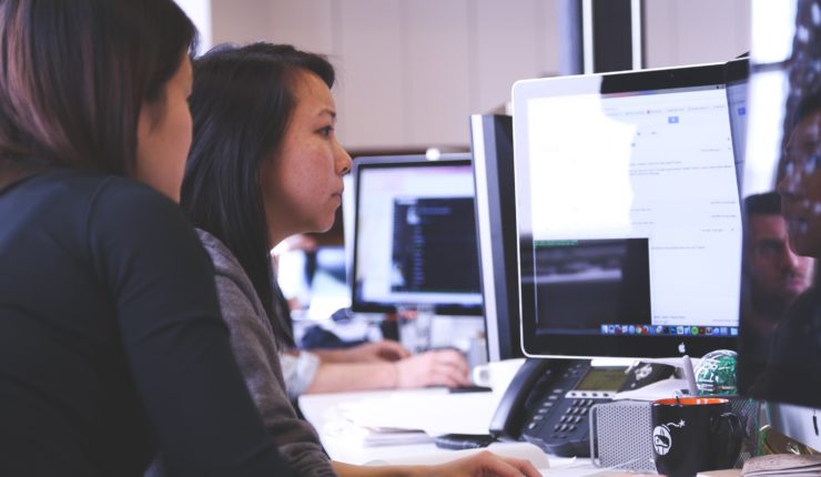 2 women working on a computer