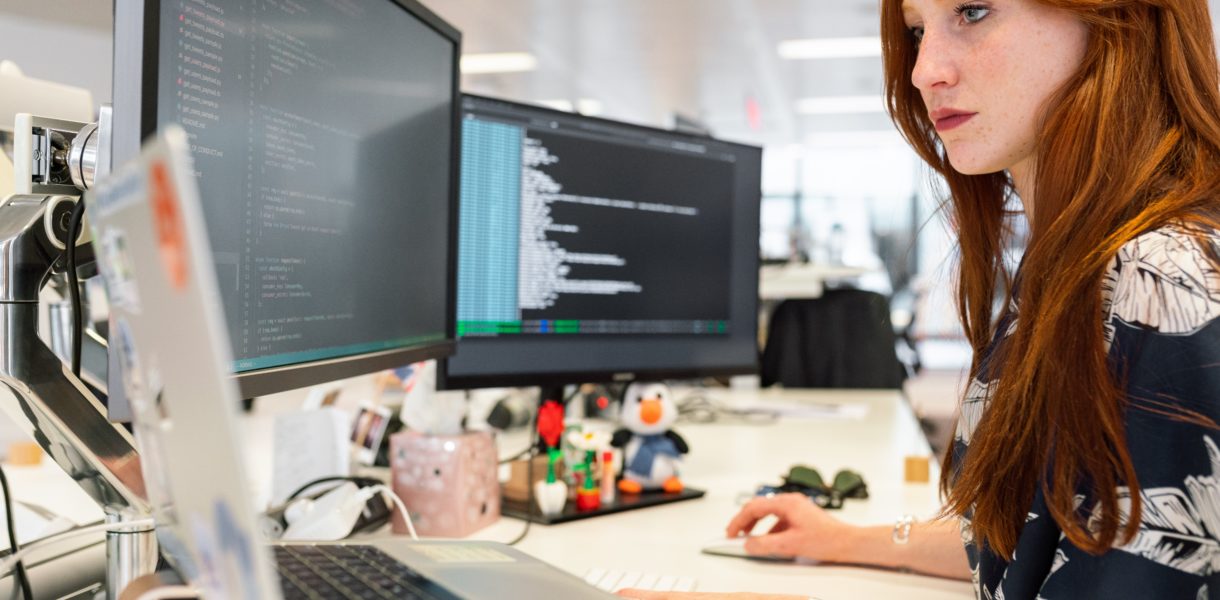 Woman working multy screens