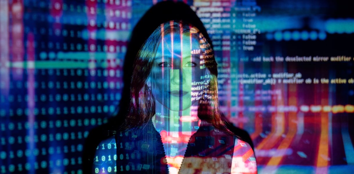 Woman stood in from a digital projector