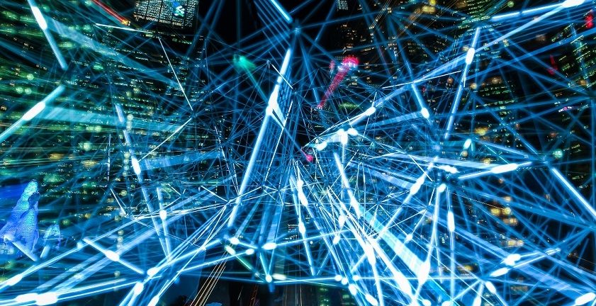 Big Data visualisation through neon tubes by a night cityscape
