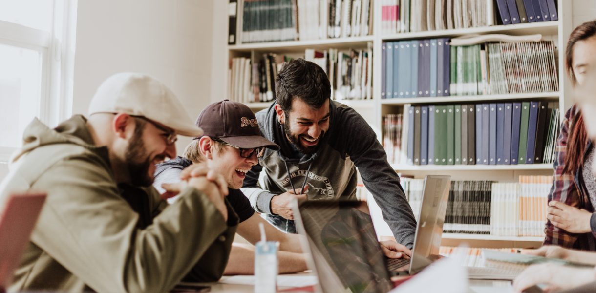 Group of people working together with computers
