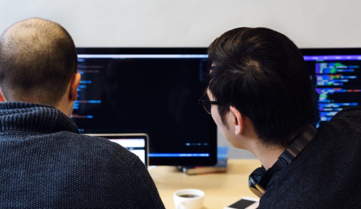 Two programmers reviewing their responsible technology