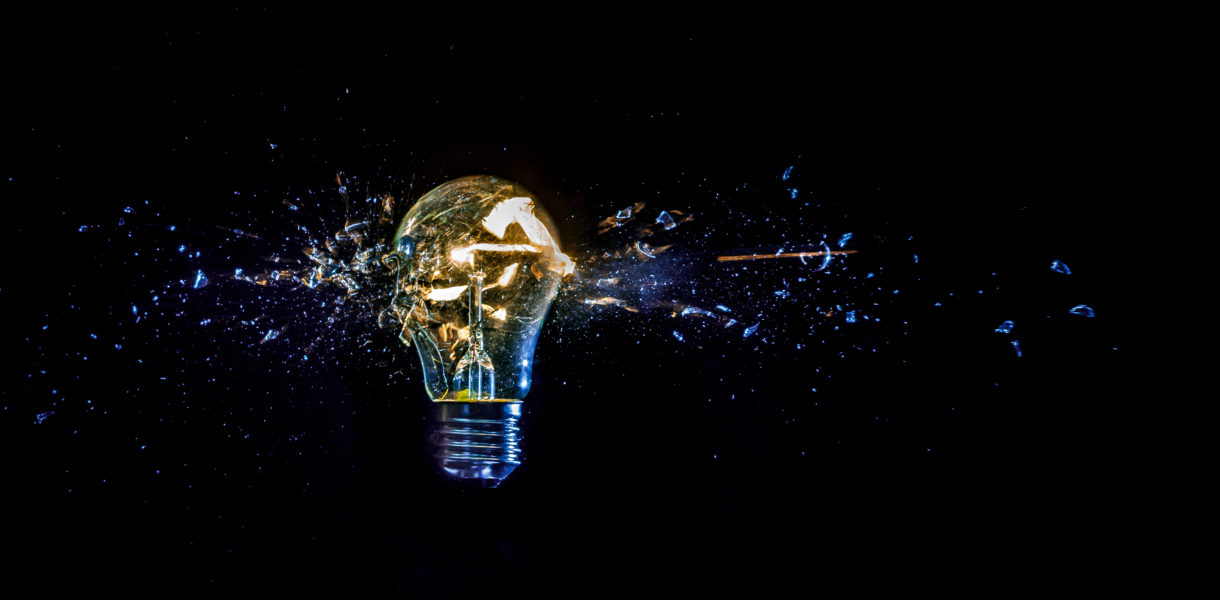 osmic,Explosion,Of,Burning,Light,Bulb,With,Flying,Splinters,Of