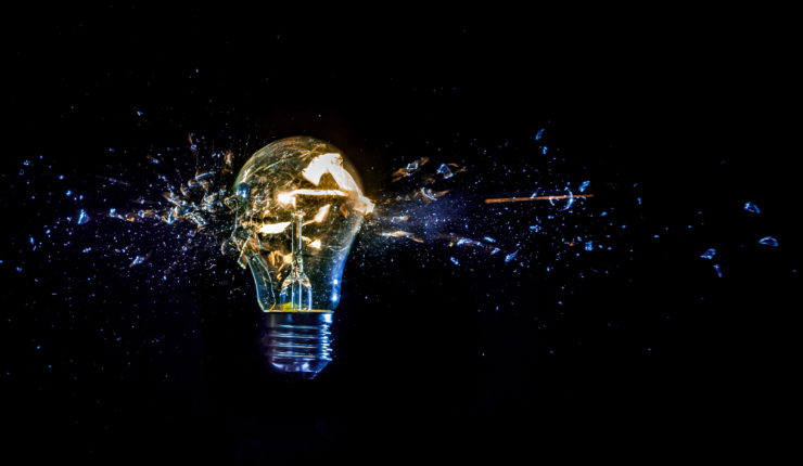 osmic,Explosion,Of,Burning,Light,Bulb,With,Flying,Splinters,Of