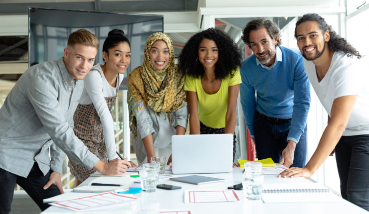 Front,View,Of,Diverse,Business,People,Looking,At,Camera,While