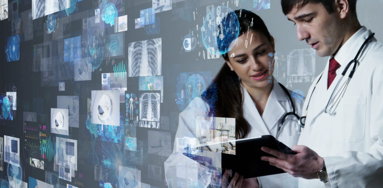 Medical Man and woman looking at a device