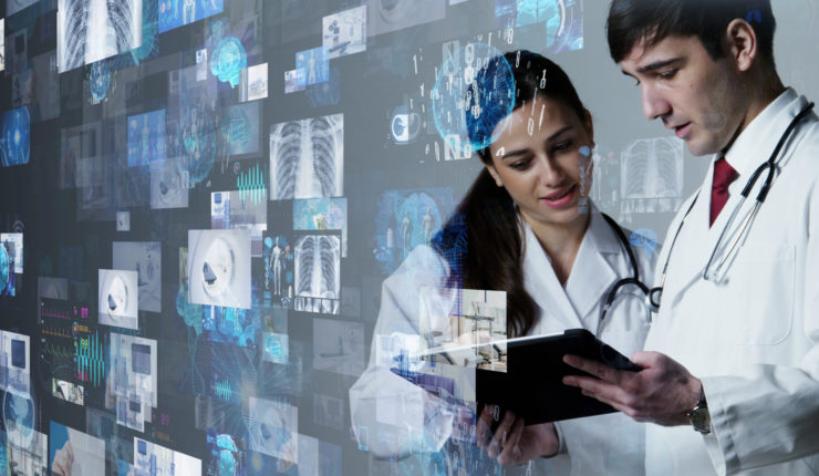 Medical Man and woman looking at a device