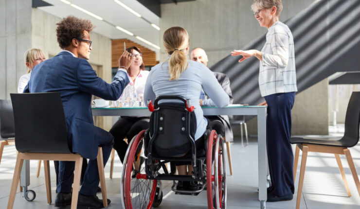 Group,Of,Business,People,In,A,Meeting,With,Colleague,In