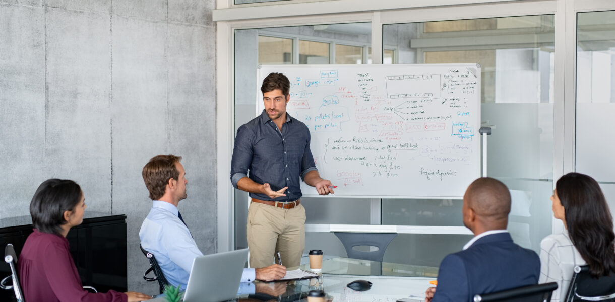 Company,Executive,Presenting,New,Management,Strategy,To,Team,In,Conference