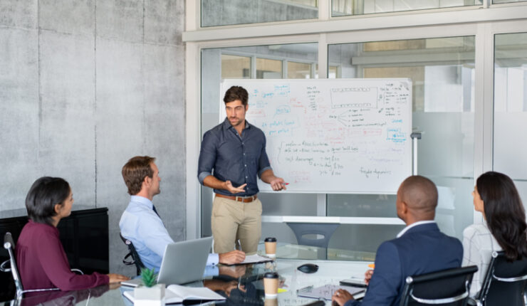 Company,Executive,Presenting,New,Management,Strategy,To,Team,In,Conference