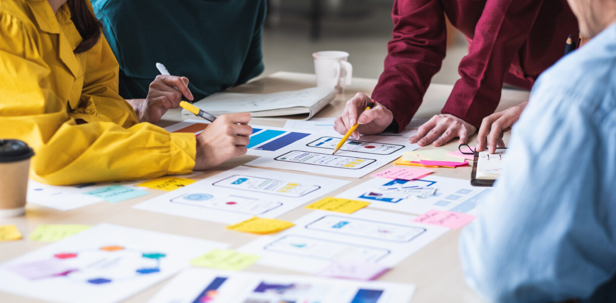 Close,Up,Ux,Developer,And,Ui,Designer,Brainstorming,About,Mobile