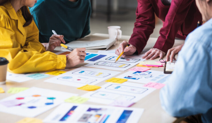 Close,Up,Ux,Developer,And,Ui,Designer,Brainstorming,About,Mobile