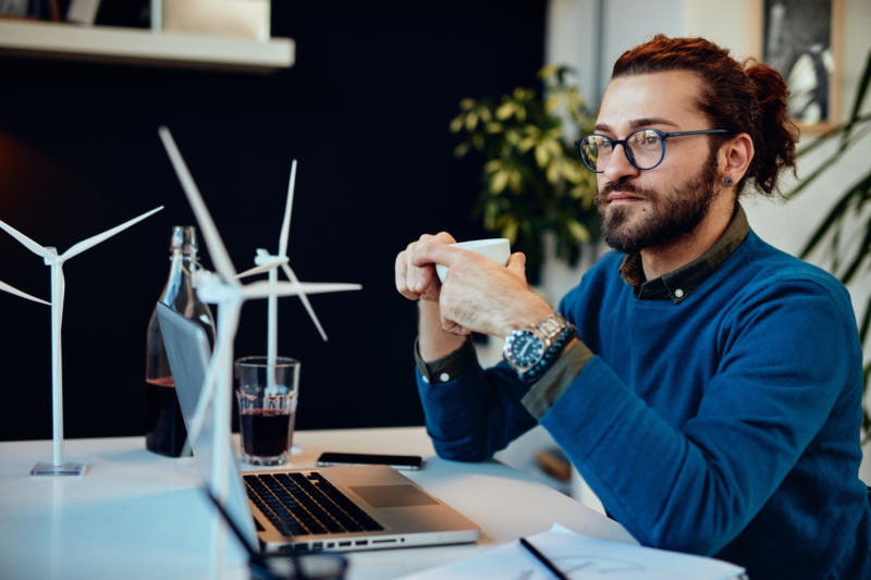 Attractive,Caucasian,Bearded,Entrepreneur,Sitting,In,His,Home,Office,,Taking