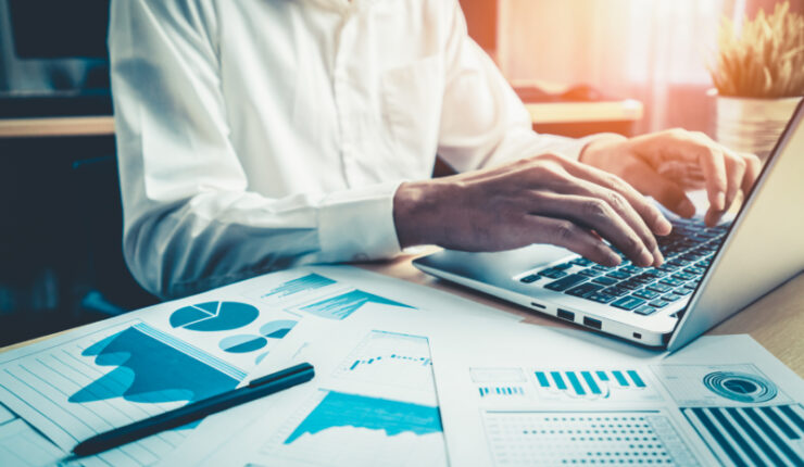 Businessman,Accountant,Or,Financial,Expert,Analyze,Business,Report,Graph,And