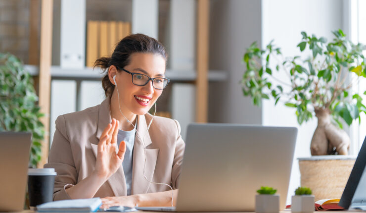 Happy,Casual,Beautiful,Woman,Working,On,A,Laptop,,Talking,With