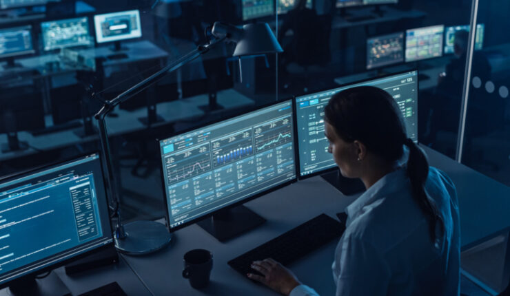 Female,Software,Engineer,Working,In,A,Modern,Monitoring,Office,With