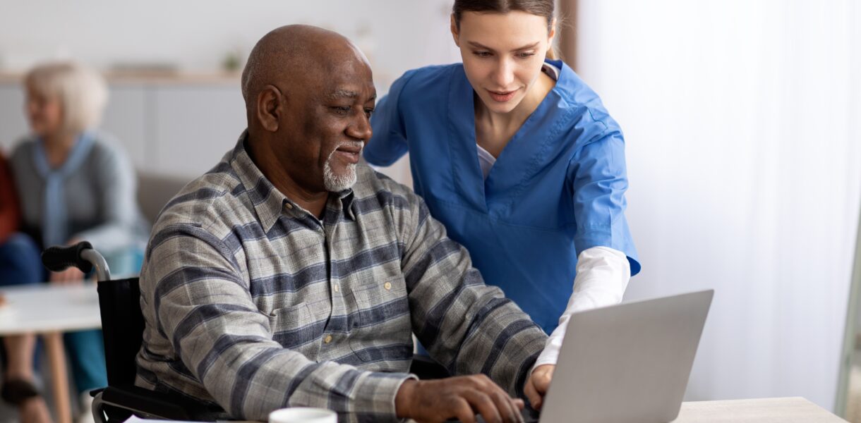 Friendly,Young,Woman,Nurse,Helping,Black,Senior,Man,In,Weheelchair