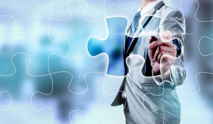Businessman,Working,On,Digital,Jigsaw,Screen,,Business,Strategy,Concept