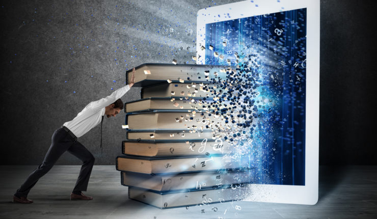 Man pushing books into a tablet device