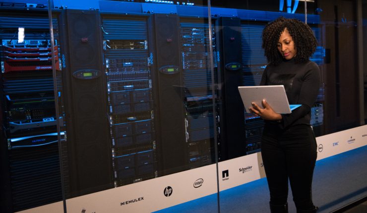 Woman standing using laptop