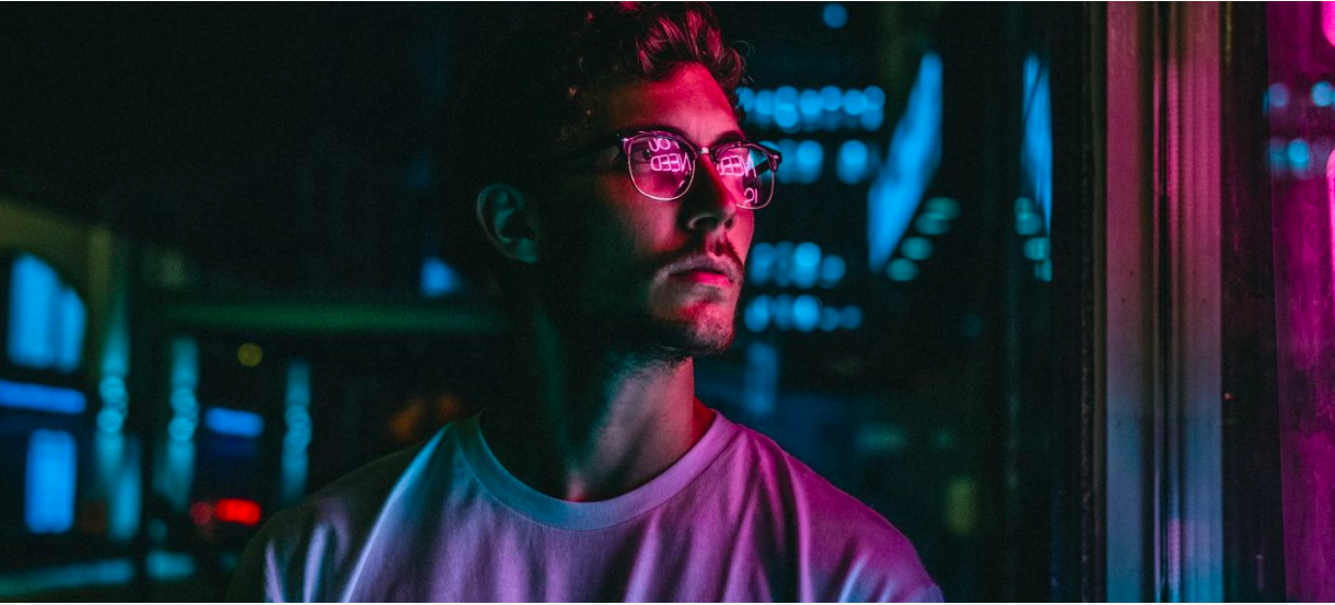 man looking at shop window