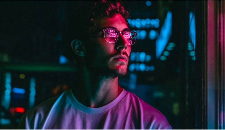 man looking at shop window